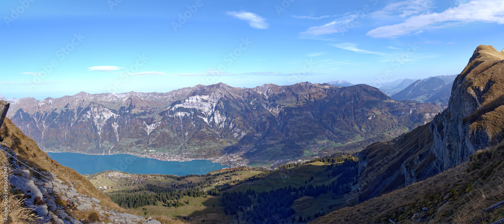 Beautiful wide angle autumn landscape at Bernese Oberland with Bernese Alps, Lake Brienz and mount B