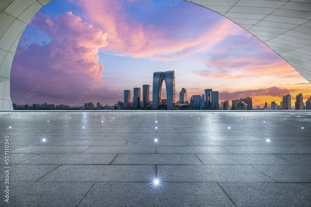 Empty floor and modern city skyline with building at sunset in Suzhou, Jiangsu Province, China.