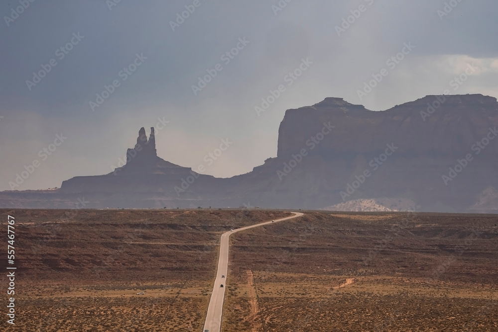 Aerial view of country road leading towards Monument Valley. Scenic view of landscape with sky in ba