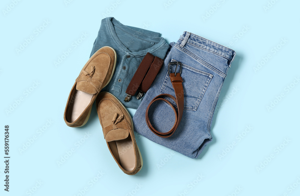 Male clothes, shoes and accessories on blue background