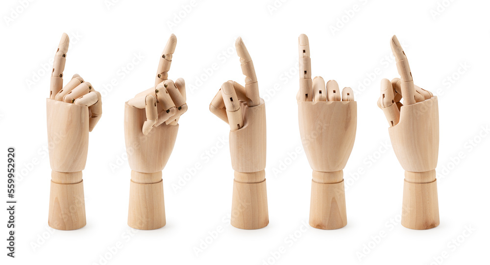 木制人体模型的手指向白色背景。不同的角度。