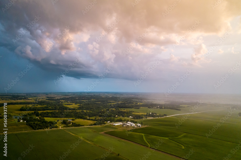 Aerial view of landscape after rain, rainbow in clouds