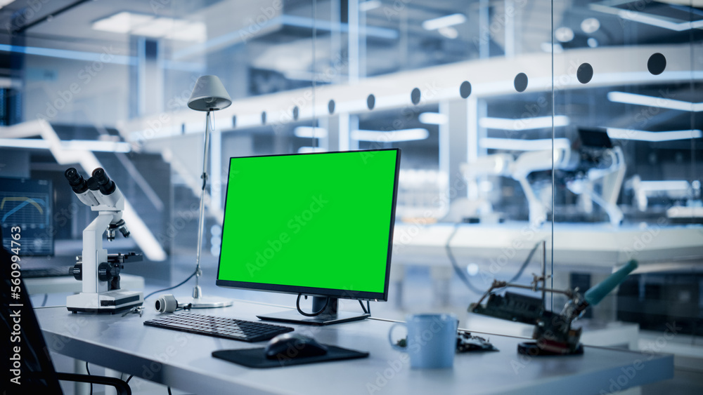 Modern Industrial Research Laboratory with Desktop Computer with Green Screen Mock Up Display. Scien