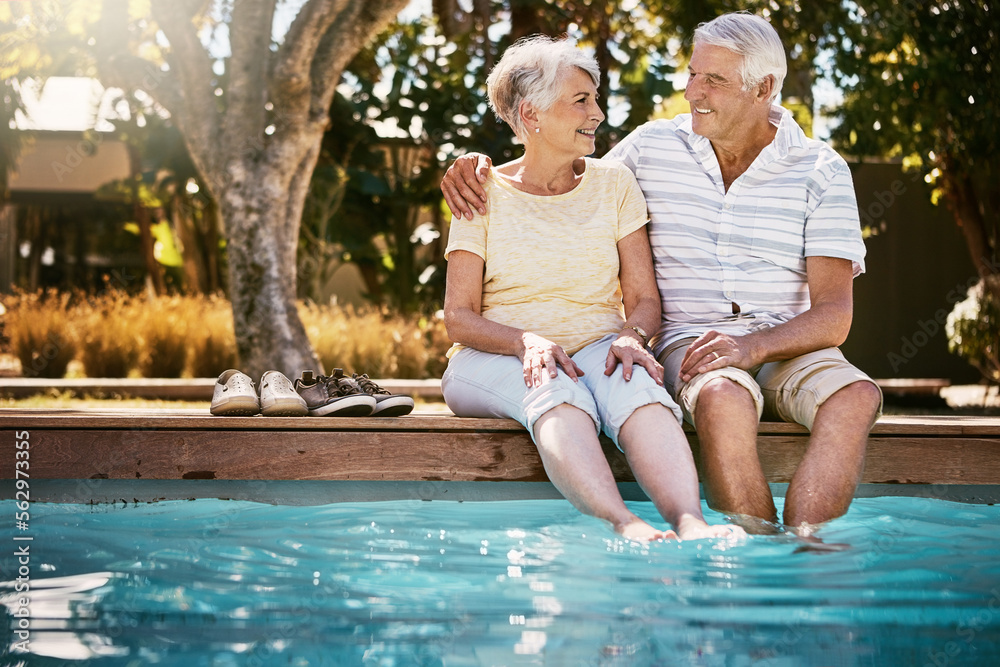 Senior couple, hug and swimming pool for holiday in relax for love or quality bonding time together 