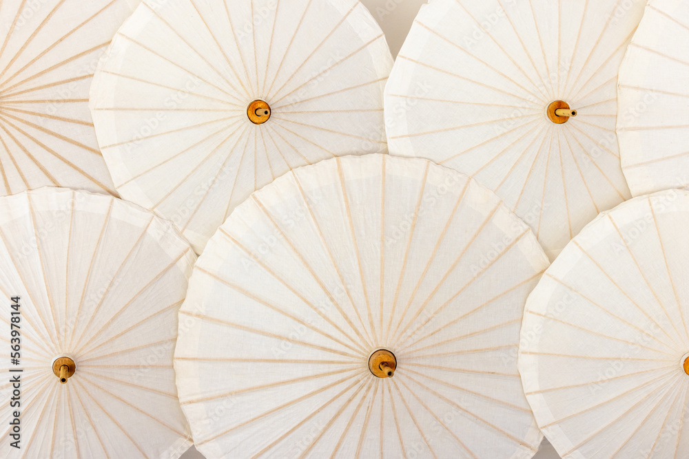 Hand made white paper umbrella with wood splines on  background, Background, hand made umbrella, pap