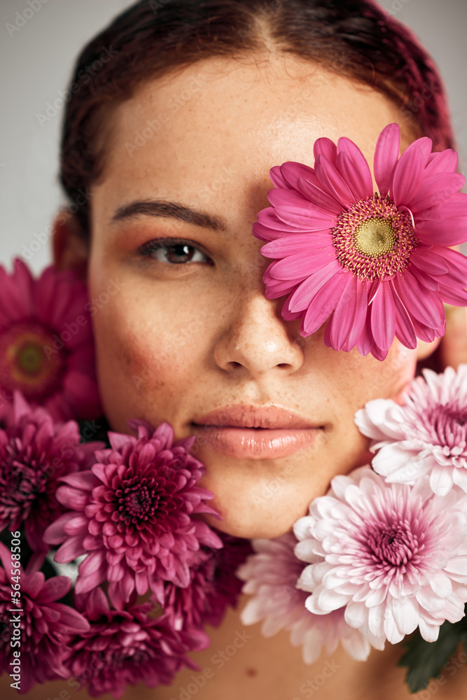 Flowers, woman and studio portrait for beauty, wellness and skincare with spring aesthetic by backgr