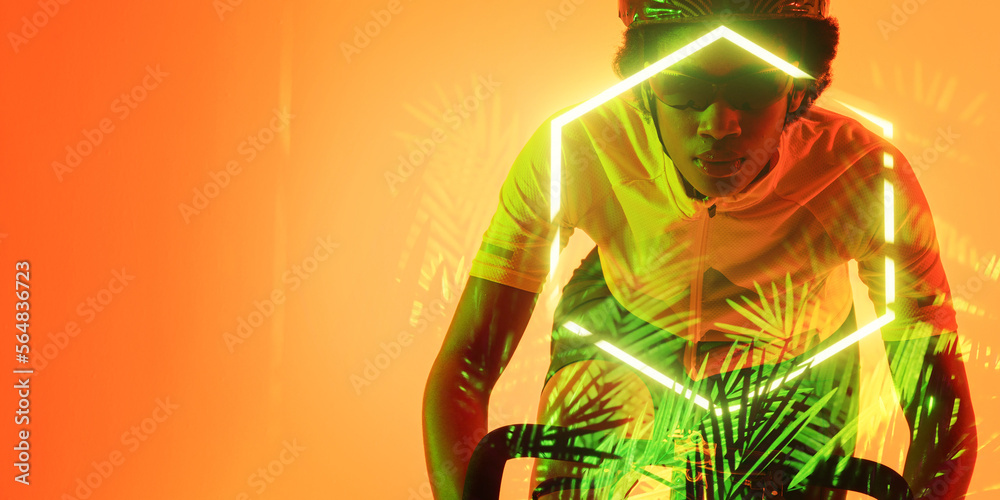 戴着眼镜和头盔的非裔美国女运动员骑着发光的六边形和植物的自行车