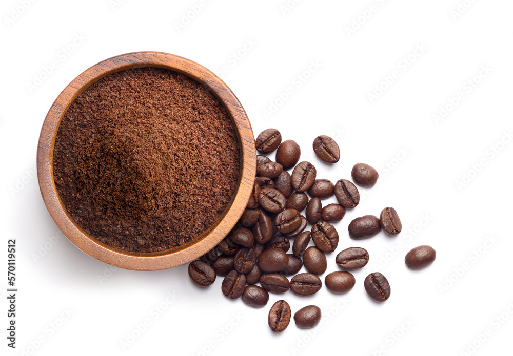 Flat lay of ground coffee with coffee beans isolated on white background.