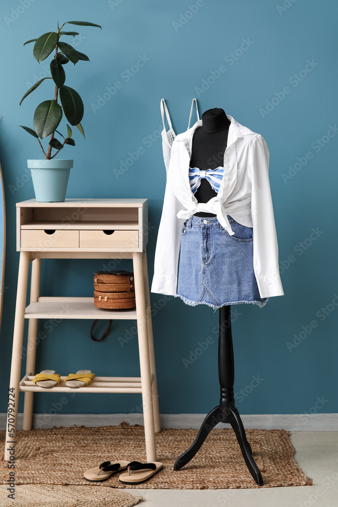 Mannequin with summer clothes in fashion designers studio