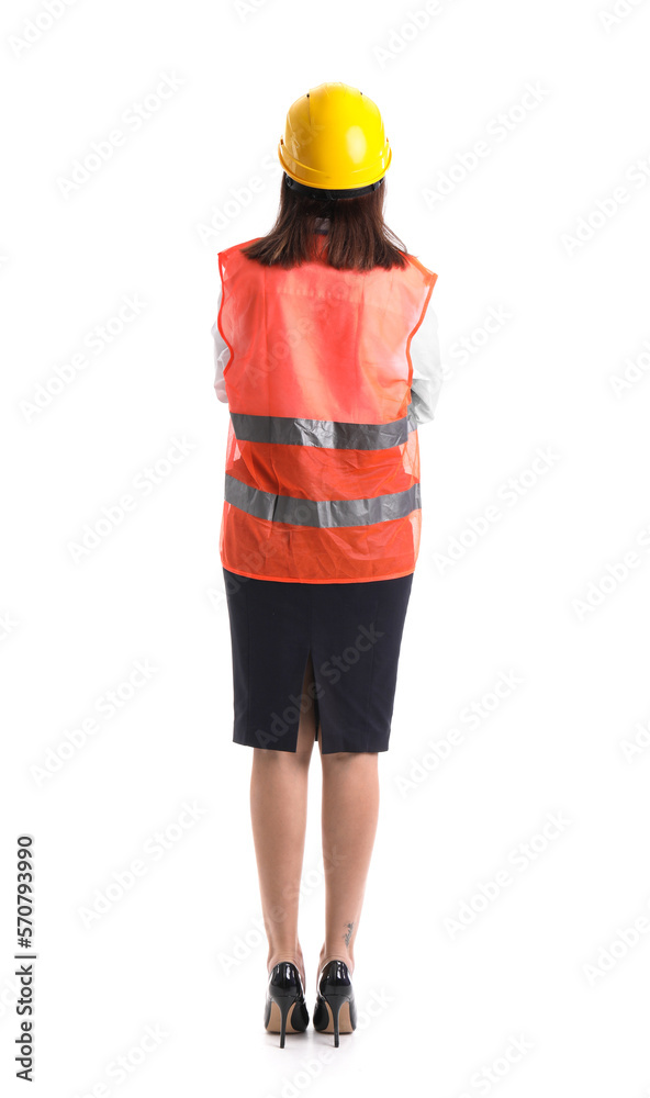 Female worker in vest and hardhat on white background, back view
