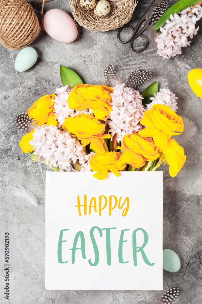 Happy Easter greeting card. Easter composition with Beautiful spring flowers and decorations top vie