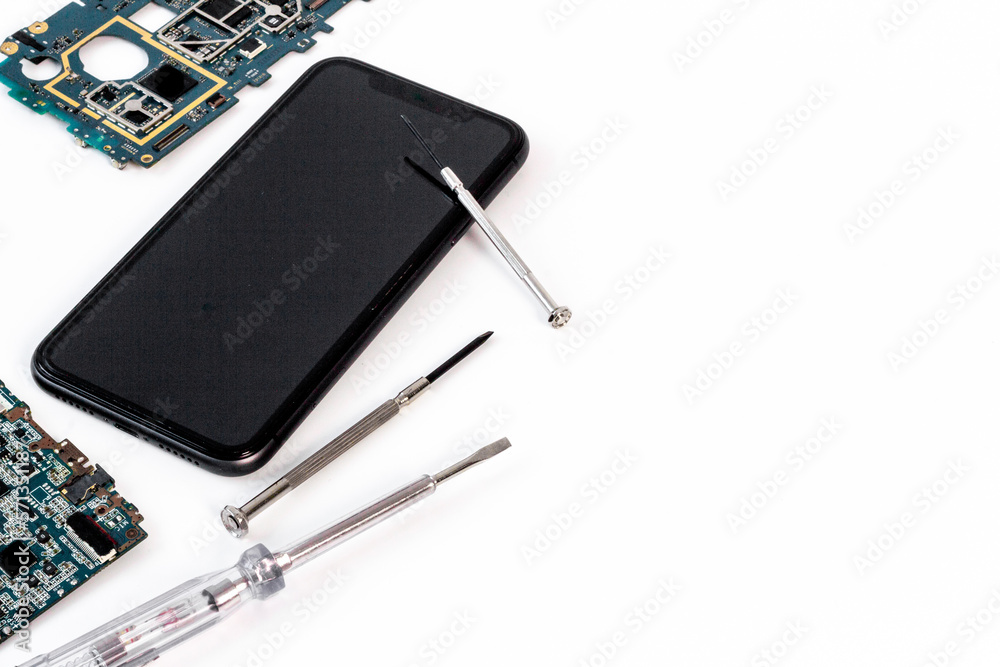 Electronics servise and repair concept - mobile phone with circuit board