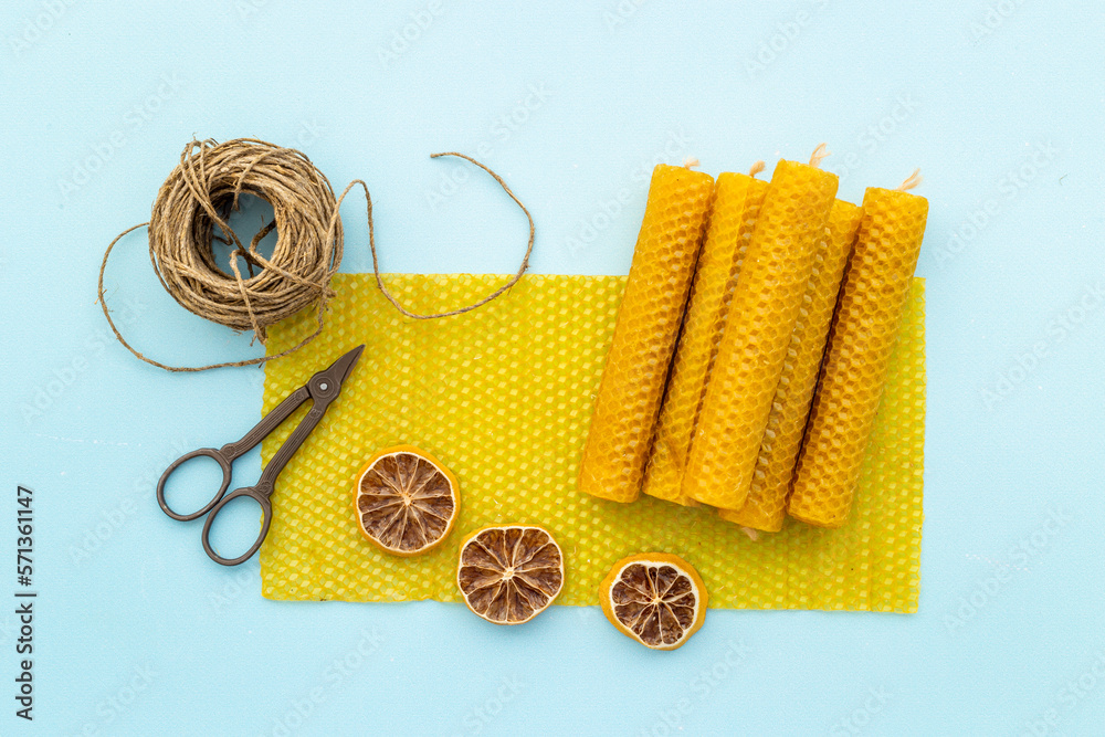 DIY concept. Handmade beeswax honey aroma candles with honeycombs