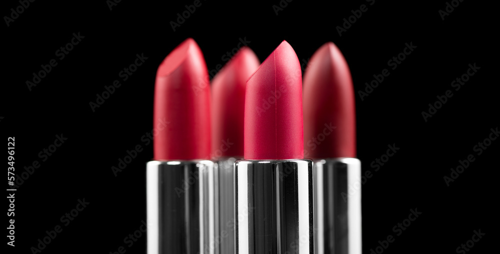 Lipstick. Fashion red Colorful Lipsticks isolated on black background. Red Matte lipstick tints pale