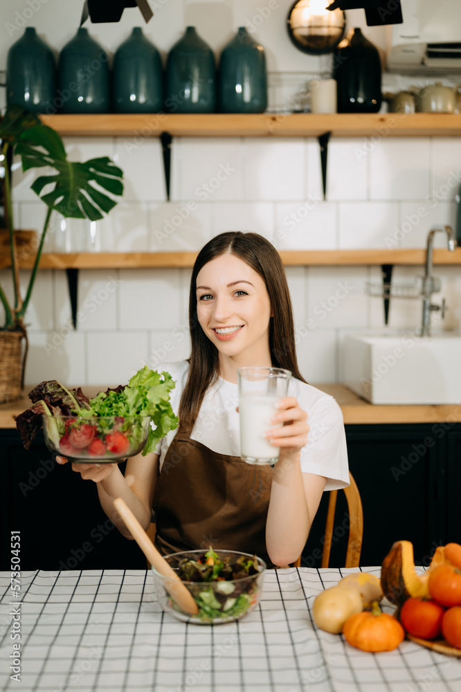 image of asian woman preparing salad in the kitchen and healthy  food in bowl at home