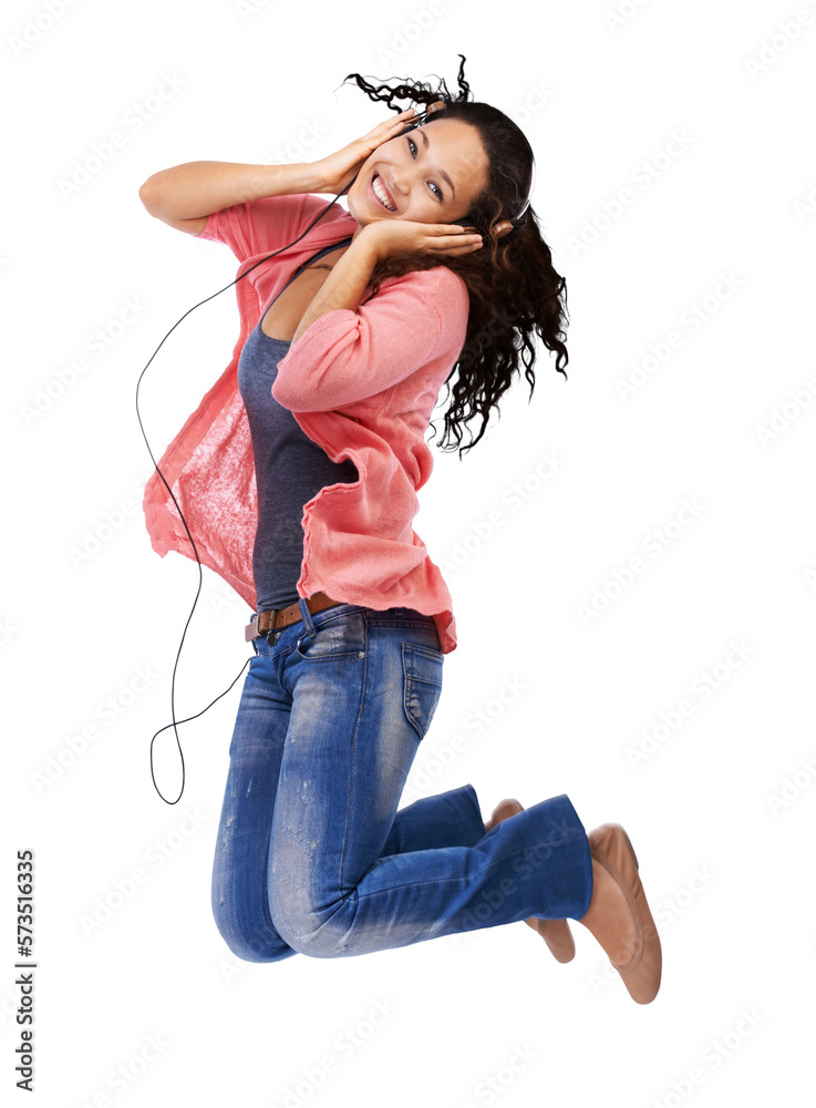 A young millennial woman jumping with enthusiasm and listening favorite music in her hifi headset an