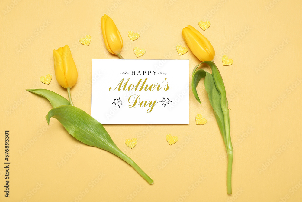 Composition with greeting card and beautiful tulip flowers on color background. Mothers Day celebra