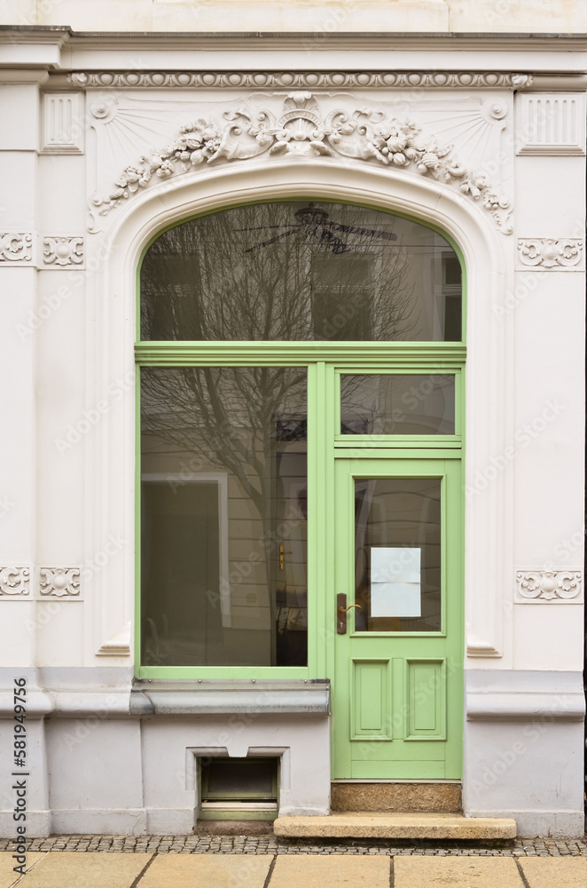 View of old building with green door and windows