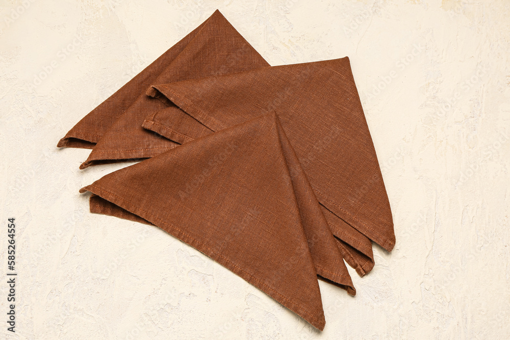 Set of folded napkins on light background