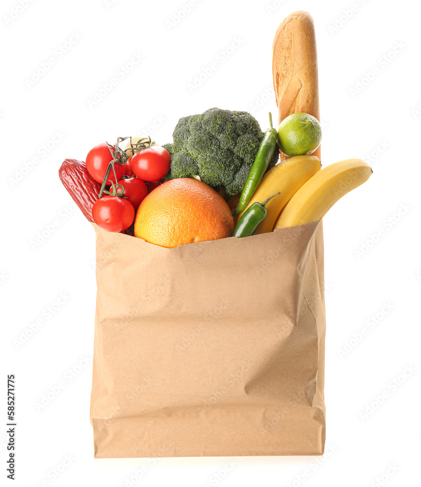 Paper bag with vegetables, fruits and bread on white background