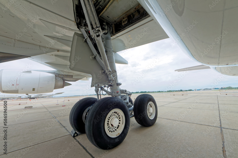 Close up of aircraft wheel parked at the airport.