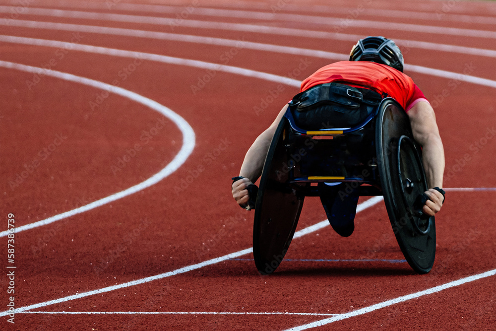 male athlete in wheelchair racing red track stadium in para athletics competition, summer sports gam