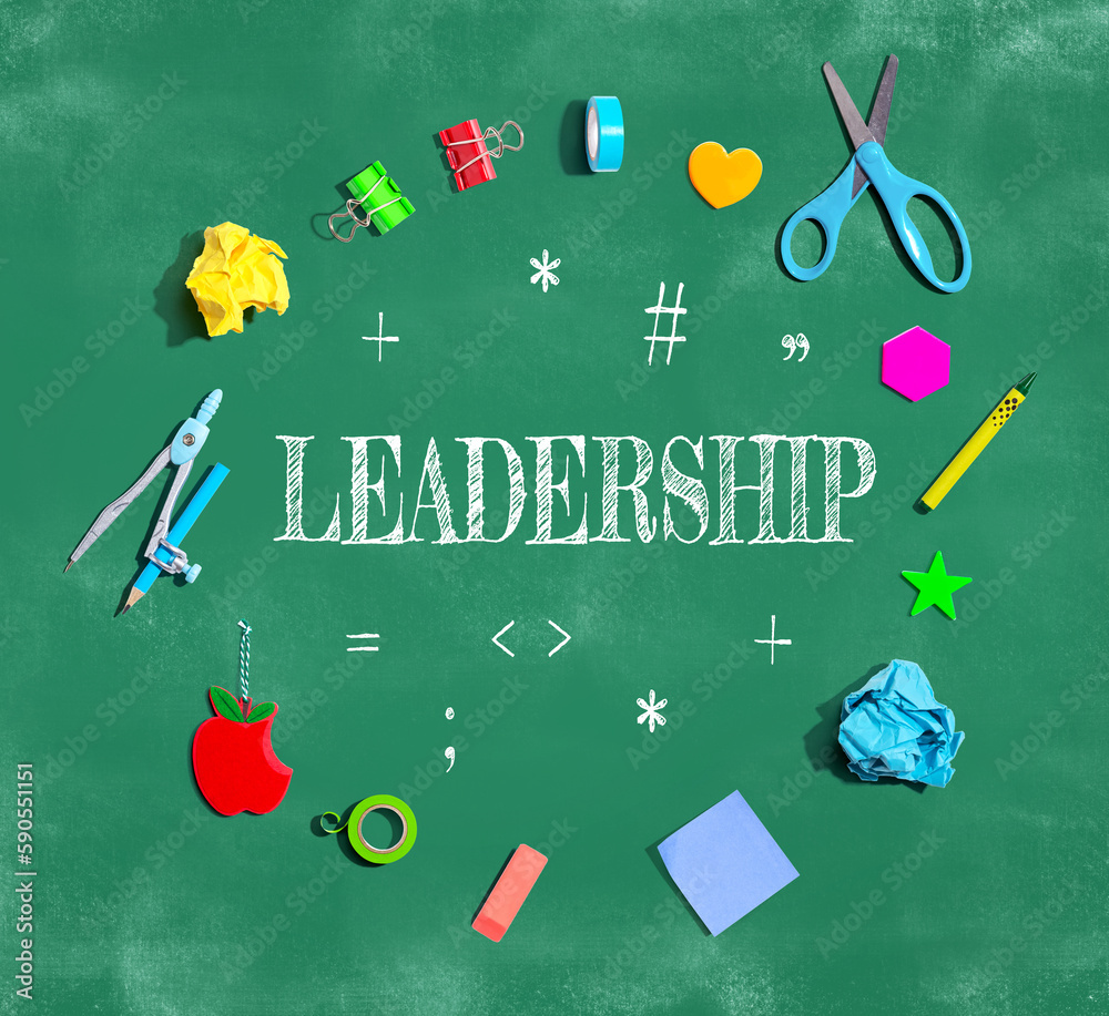 Leadership with school supplies on a chalkboard - flat lay