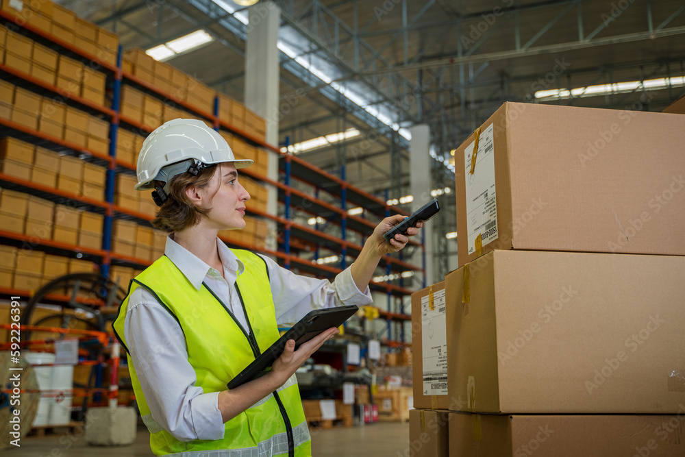 Worker scanning parcels for retail and transport shipping in warehouse stock checking,Supervisor tea