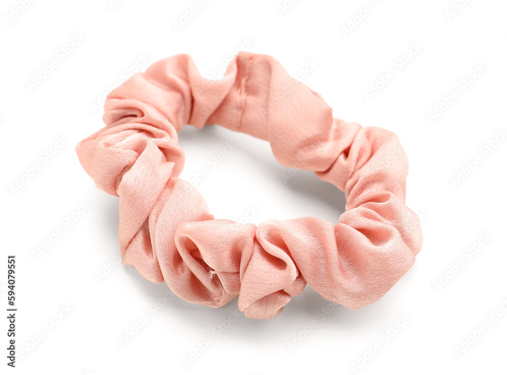 Pink silk scrunchy on white background