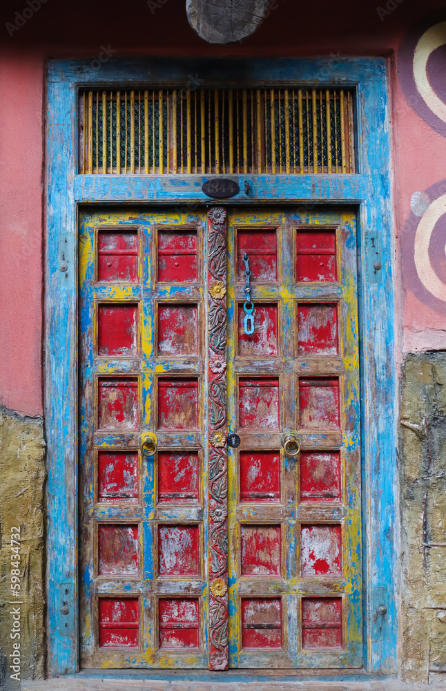 View of old building with colorful door