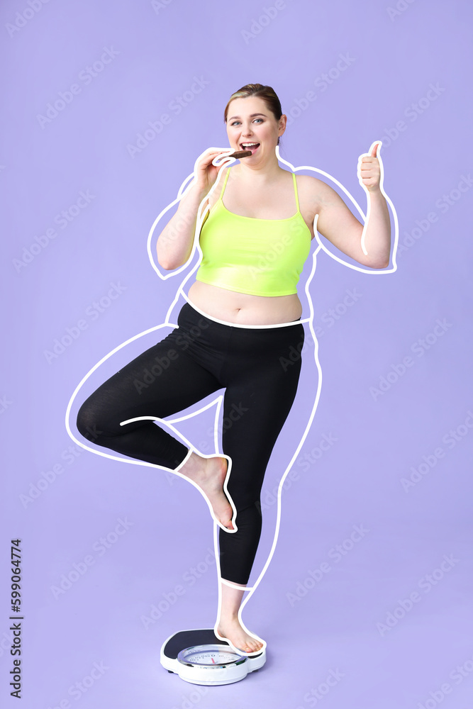 Young woman after slimming eating chocolate while standing on weight scales against lilac background