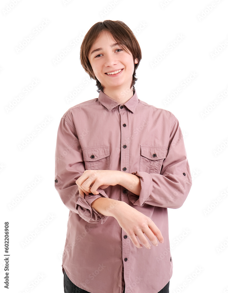 Teenage boy rolling up his sleeve on white background