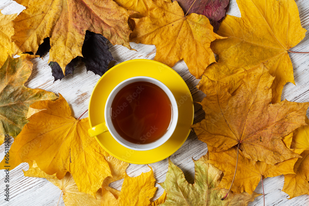 Flat lay autumn composition with cup of black tea
