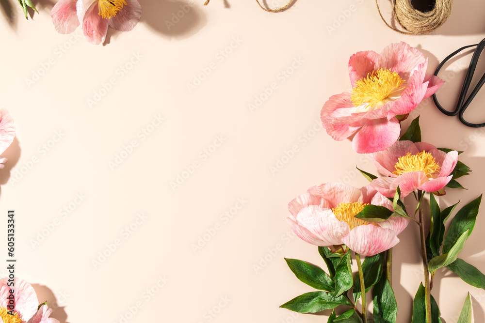 Peonies on pink background with copy space. Abstract natural floral frame layout with text space. Ro