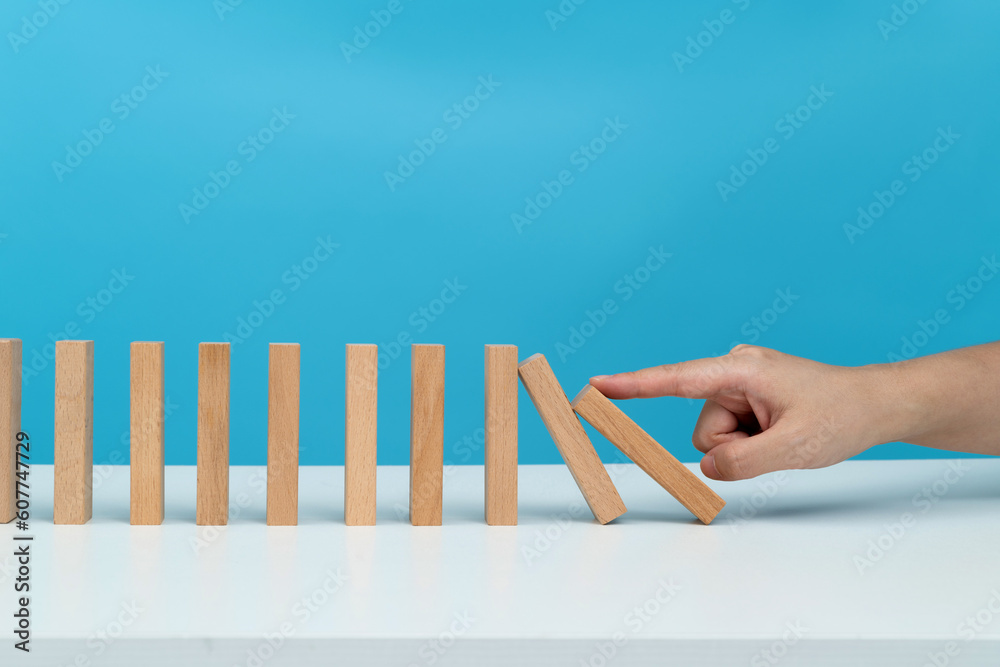 People hand pushing domino pieces