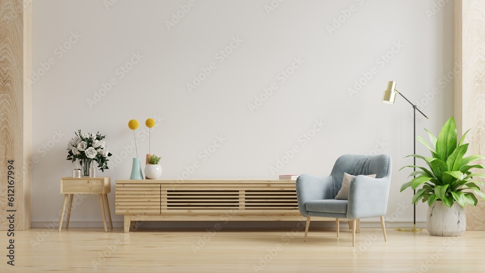 Empty living room mockup a TV wall mounted with blue armchair in living room with white wall.3d rend