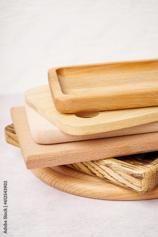 Different wooden cutting boards on white background