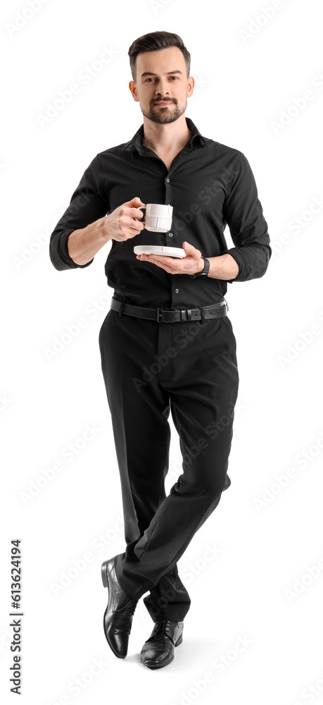 Handsome businessman with cup of coffee on white background