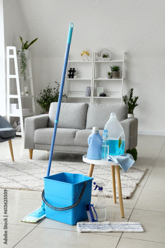 Table with cleaning supplies in living room