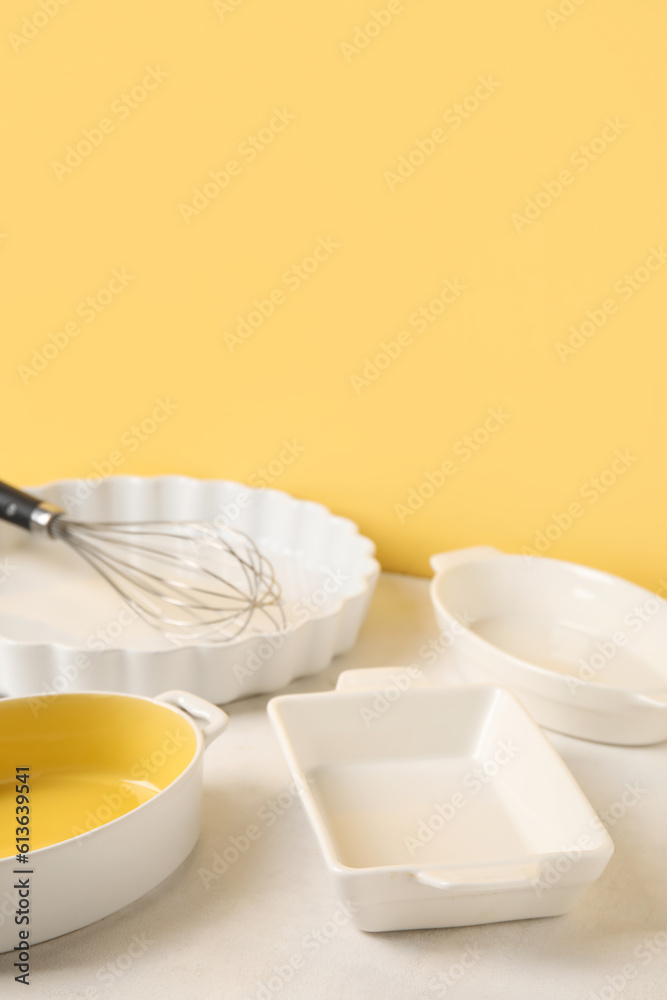 Set of different kitchen utensils for baking on color background