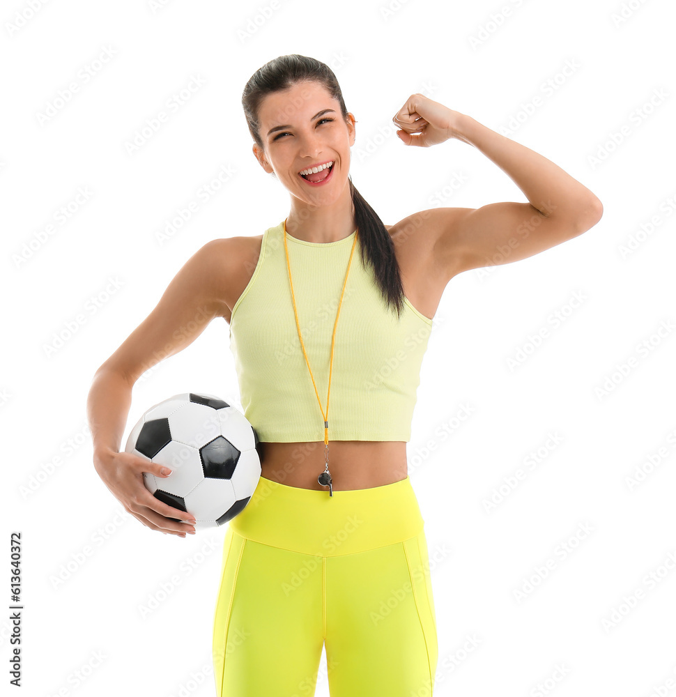 Sporty female coach with soccer ball on white background
