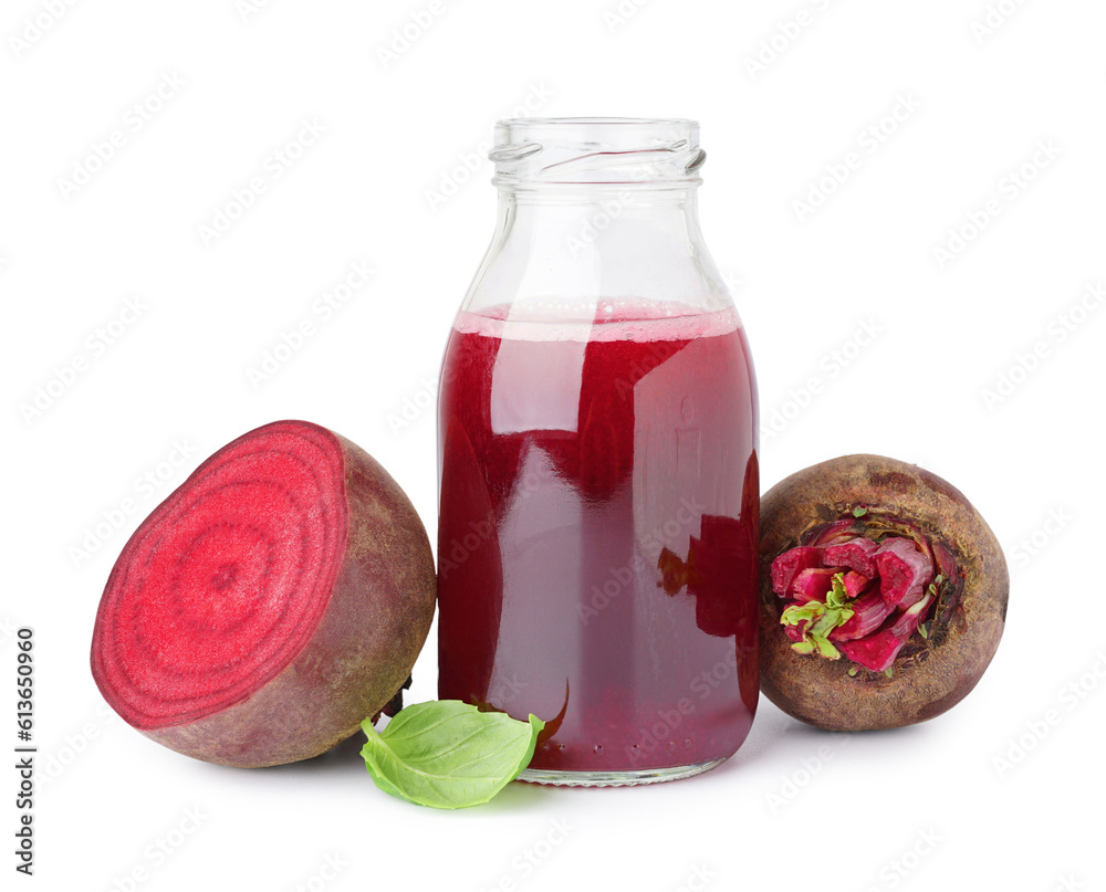 Bottle of healthy beet juice and spinach on white background
