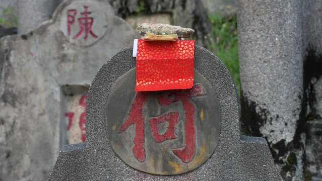 During the Chung Yeung Festival, an offering lays on top of a tombstone at the Diamond Hill cemetery as citizens visit deceased relatives' graves and bring offerings in remembrance and respect.
