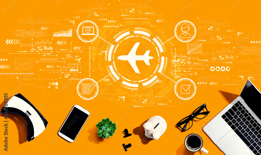 Flight ticket booking concept with electronic gadgets and office supplies - flat lay