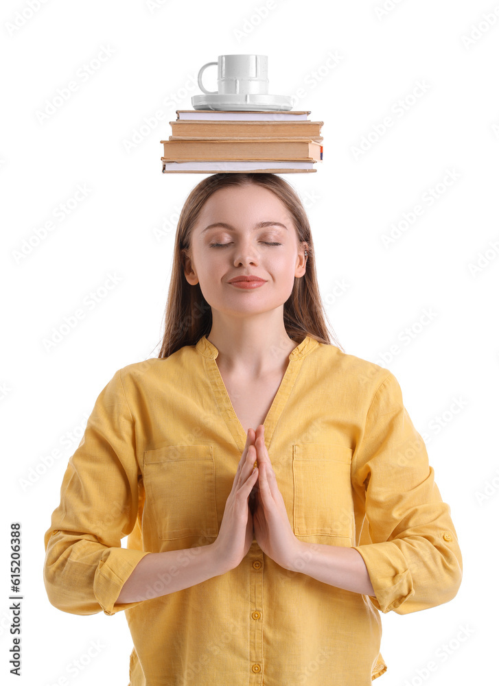 Young woman with cup and books meditating on white background. Balance concept