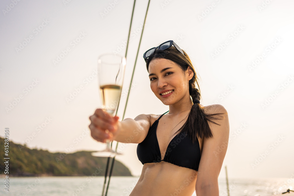 Caucasian woman in bikini drink champagne while having party in yacht. 