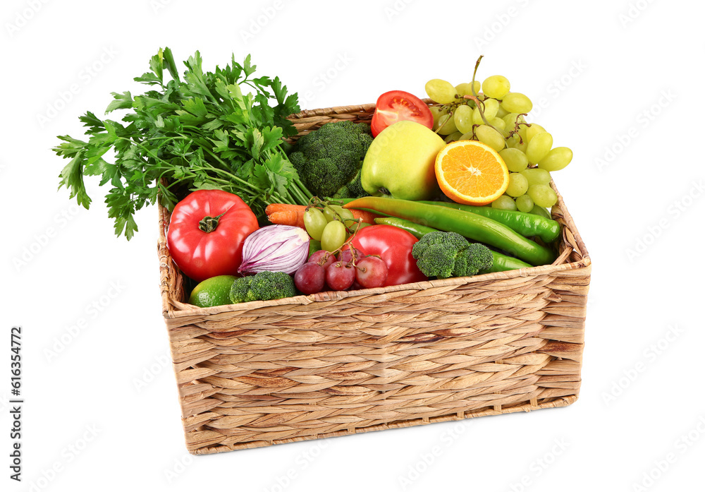 Wicker box with different fresh fruits and vegetables on white background