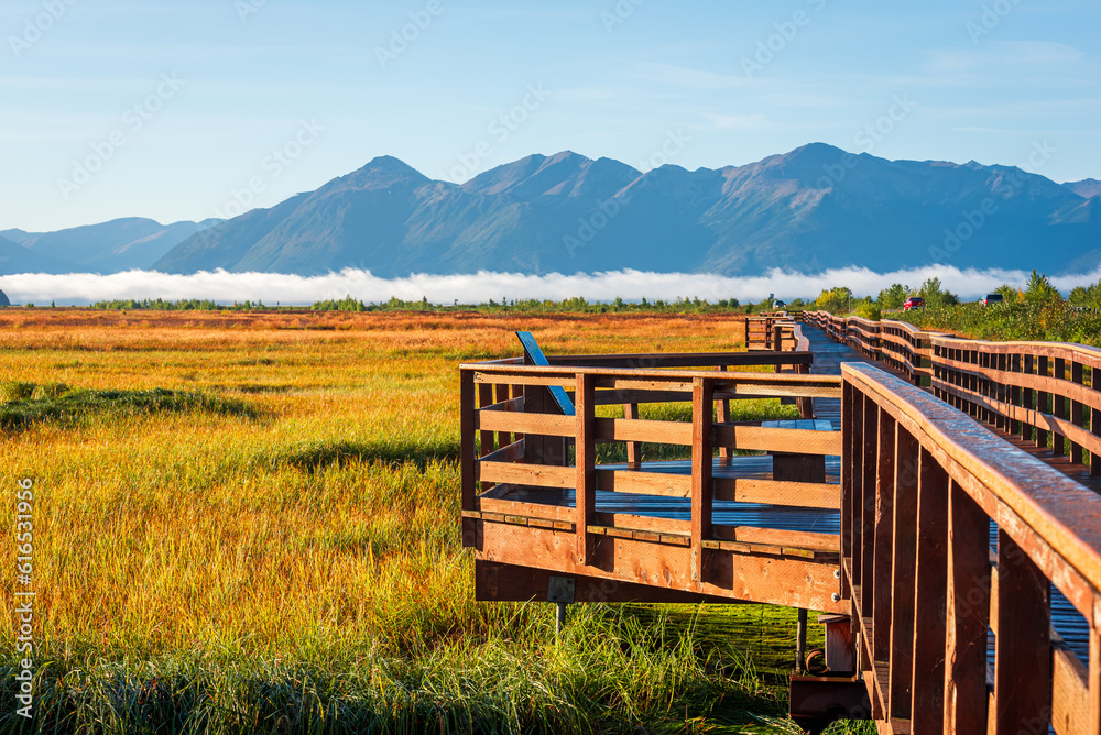 A wooden boardwalk in Potter Marsh Bird Sanctuary, Alaska.
