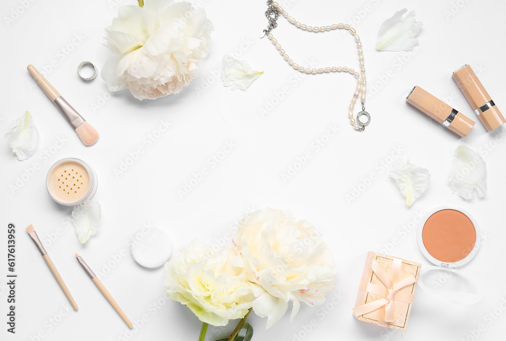 Frame made of female accessories, cosmetics and beautiful peony flowers on white background