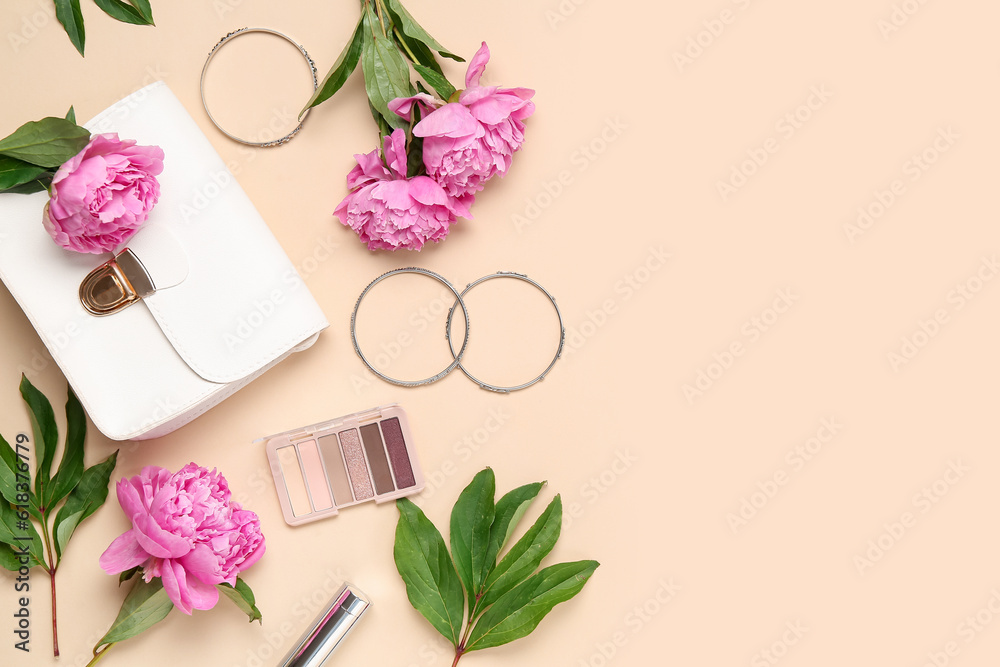 Composition with stylish female bag, bracelets, eyeshadows and beautiful peony flowers on color back